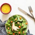 Creamy Apple Cider Dressing in a bowl next to a salad