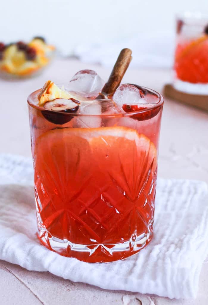 Spiced Orange Cranberry Spritz in a glass with garnish