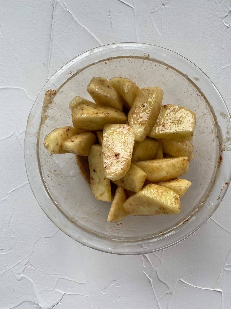 Apple with maple and cinnamon in bowl