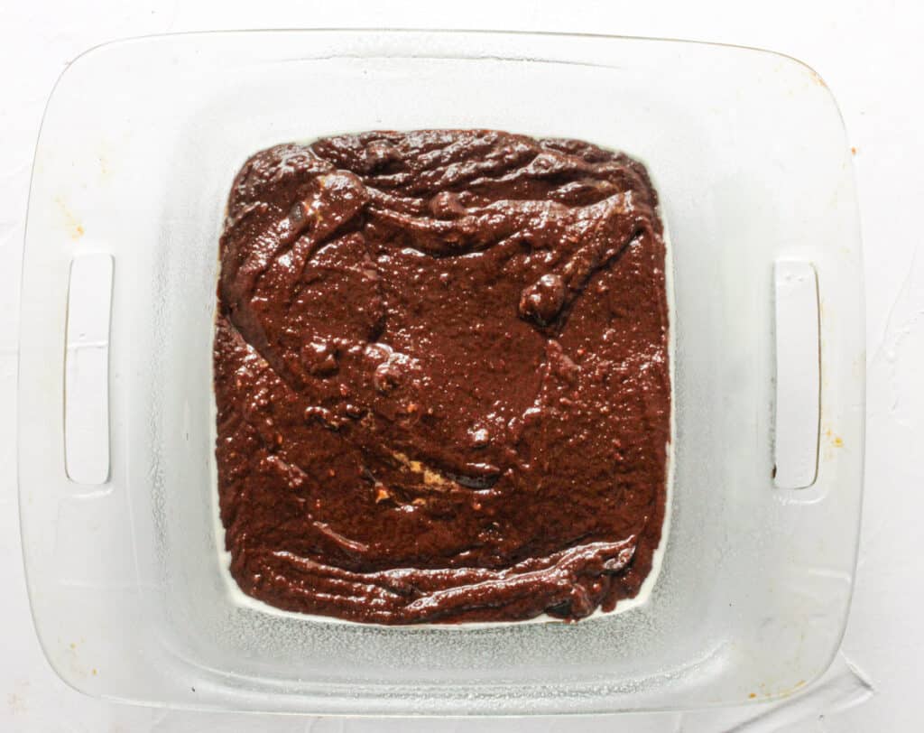 vegan brownie batter in a baking dish