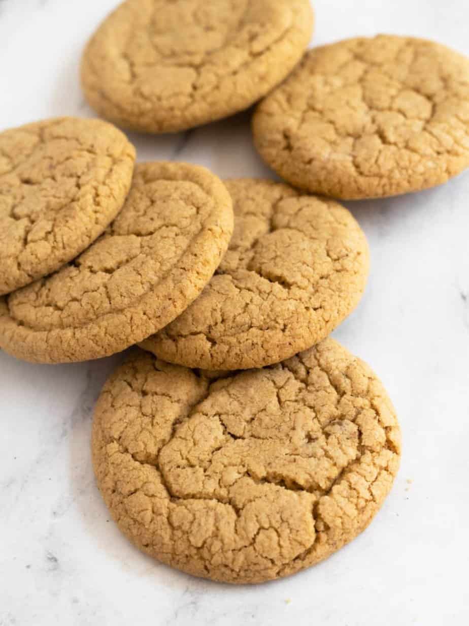 Cookie butter cookies in a laying down  stack on white paper