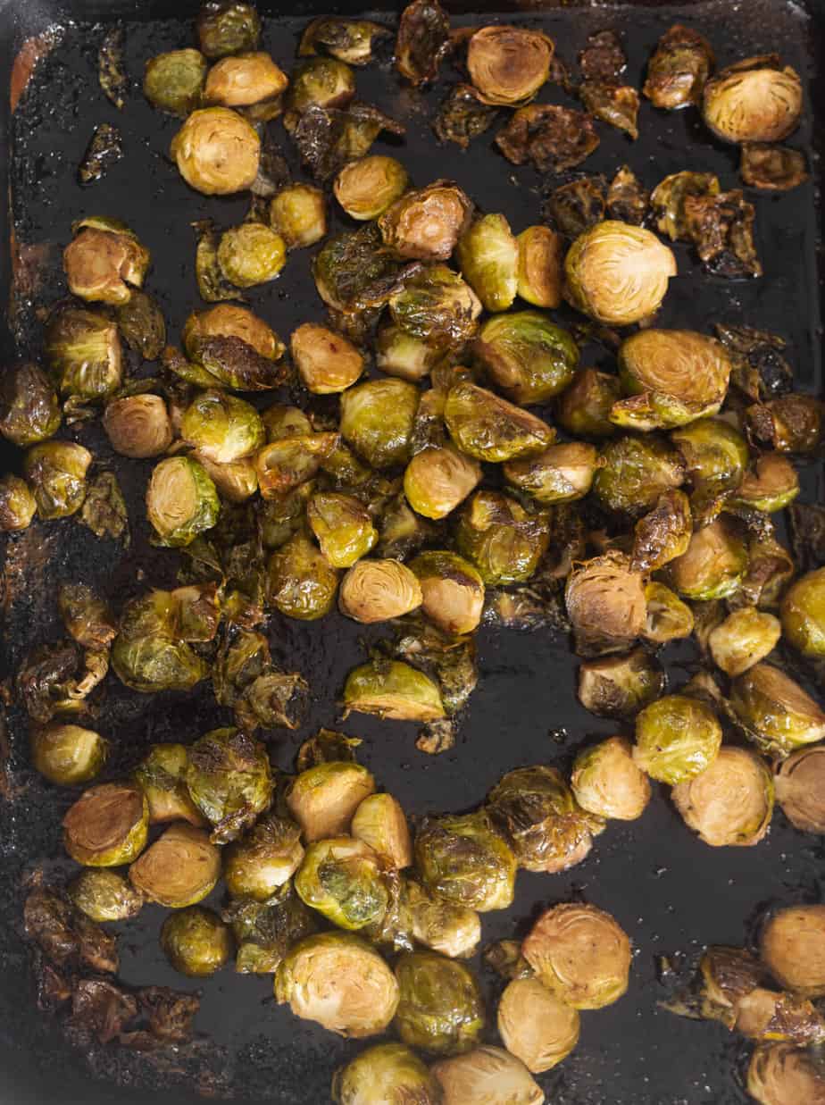 Brussel sprouts after being baked on a baking sheet