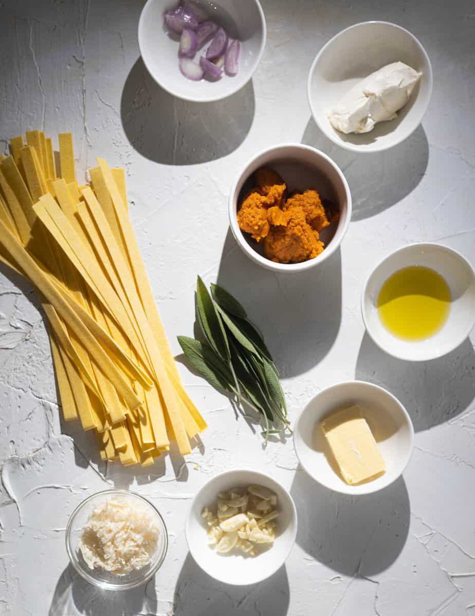 Ingredients for pumpkin pasta in individual bowls