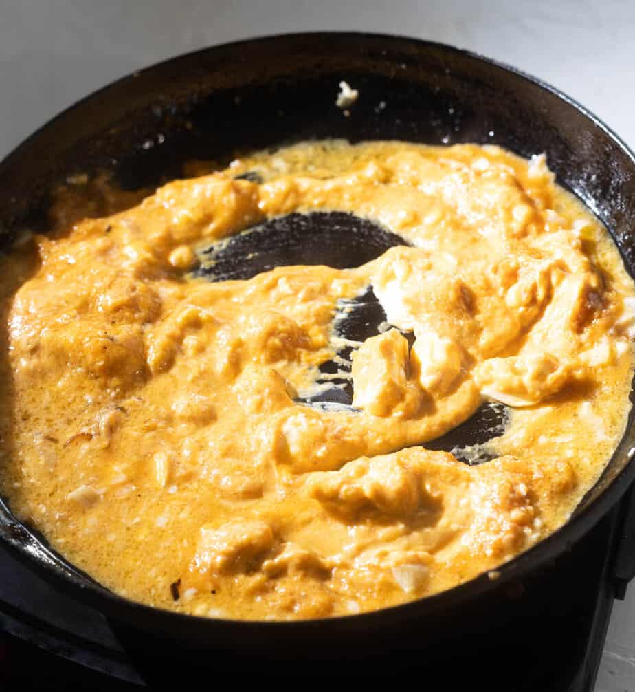 thick and creamy pumpkin sauce in a skillet on a stovetop