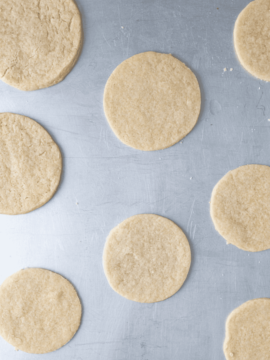 dairy free sugar cookie fully baked on a baking tray