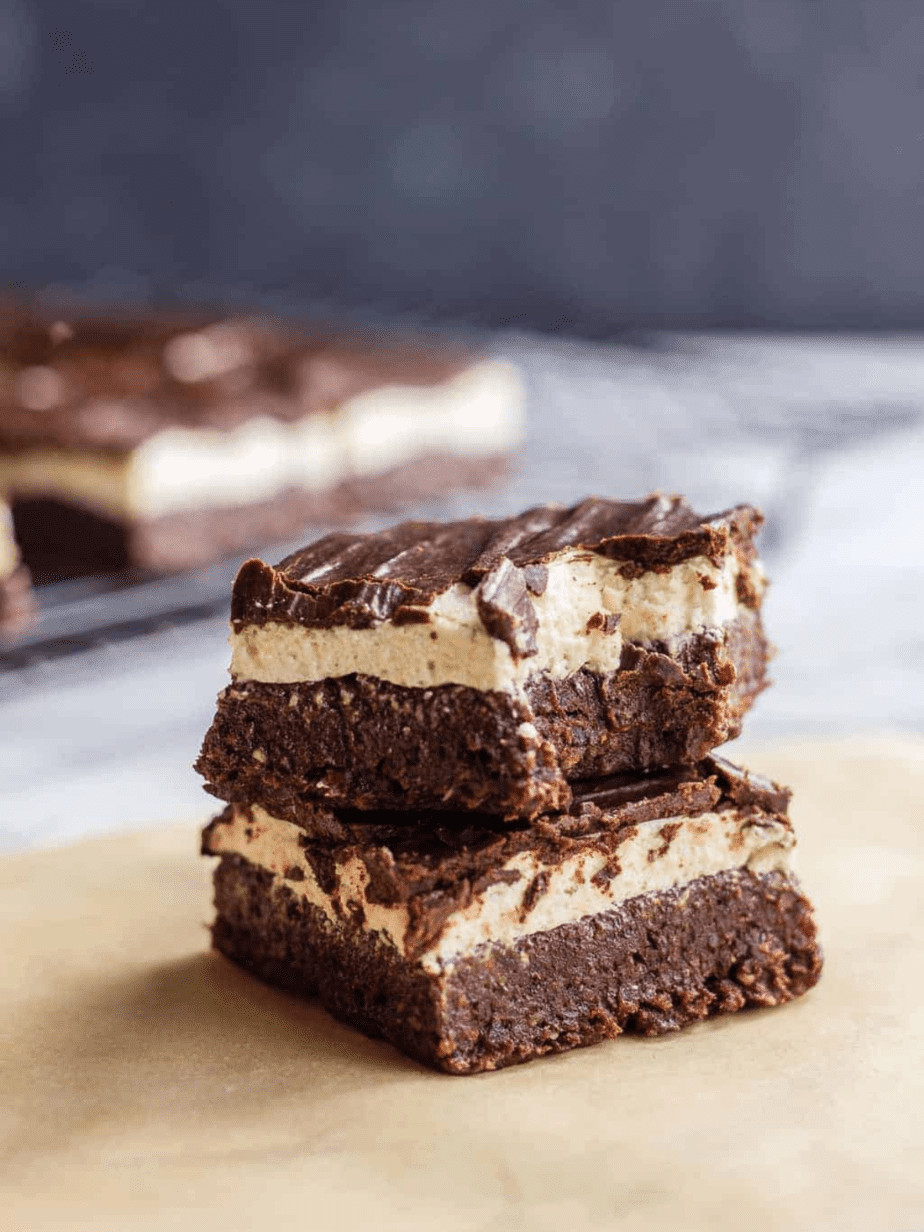 Marshmallow brownies in a stack with a bite taken out