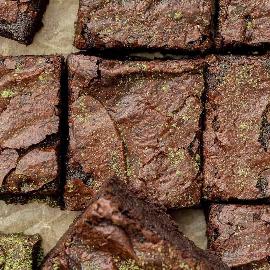 brownies with matcha sprinkles on top cut into squares 