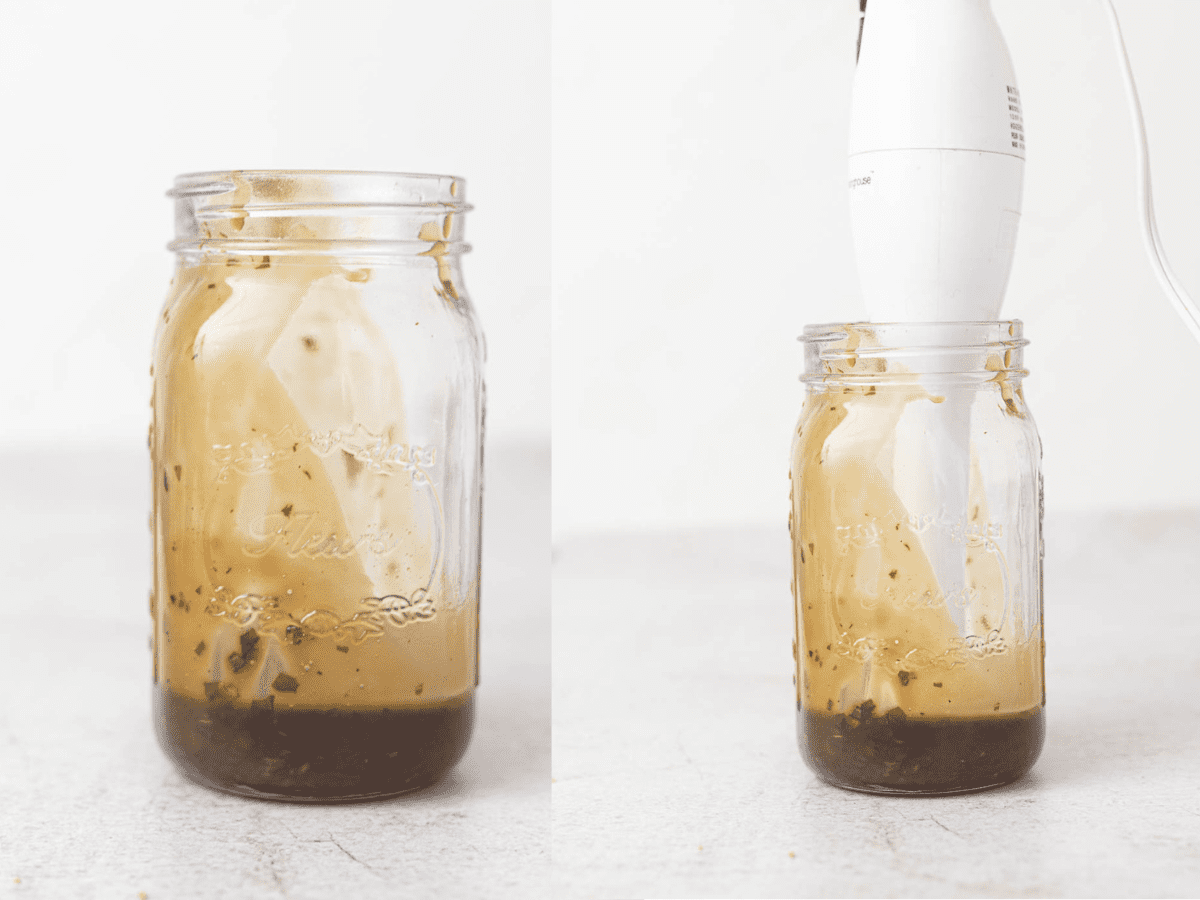 Process shot for basil balsamic dressing showing it in the mason jar with an immersion blender