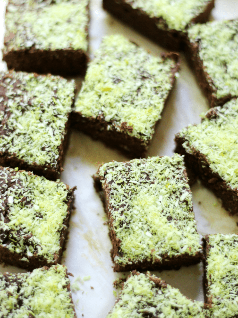 mint brownies cut into squares on parchment paper