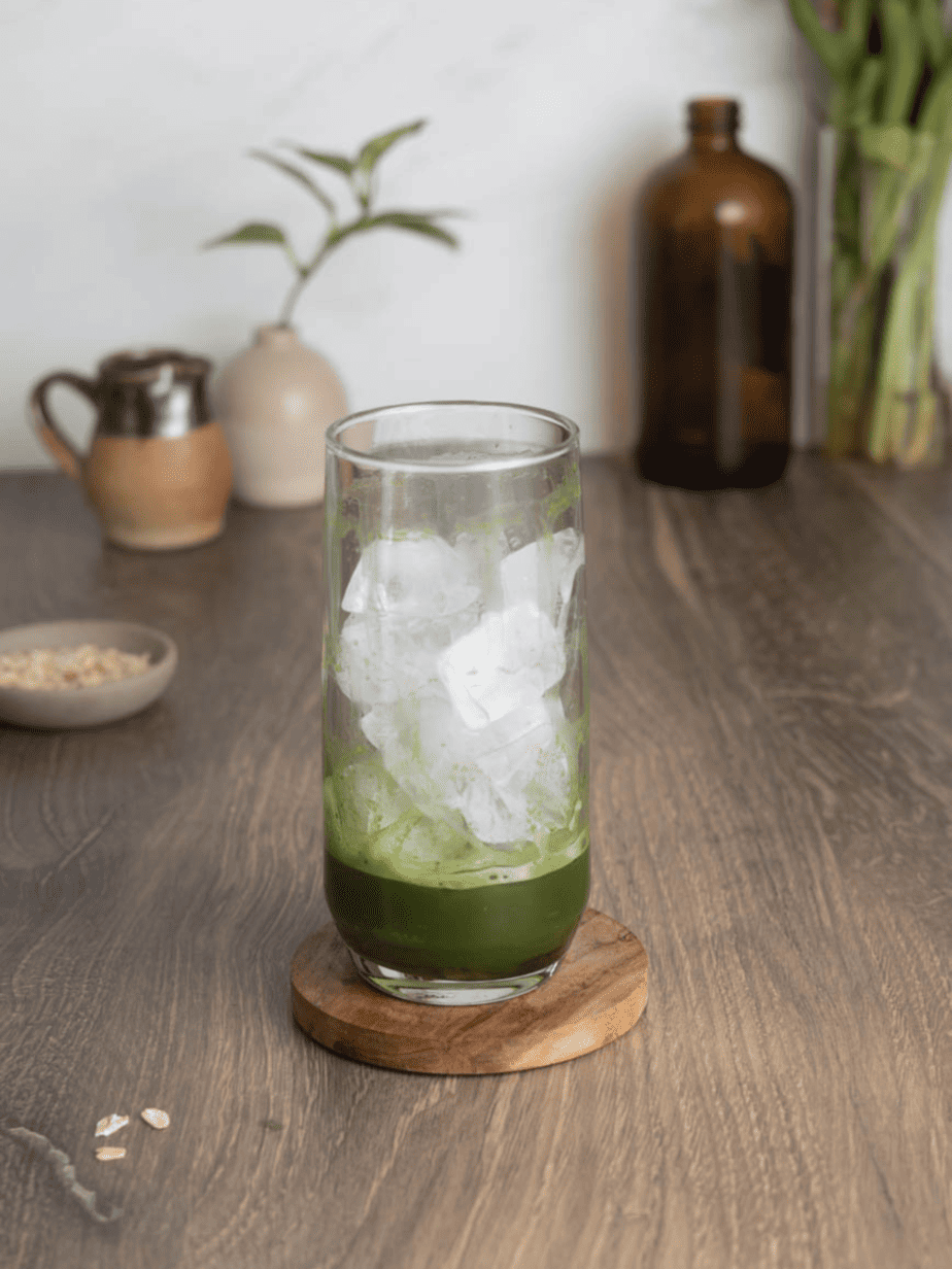 Iced Matcha Oat Milk latte with ice and matcha in glass