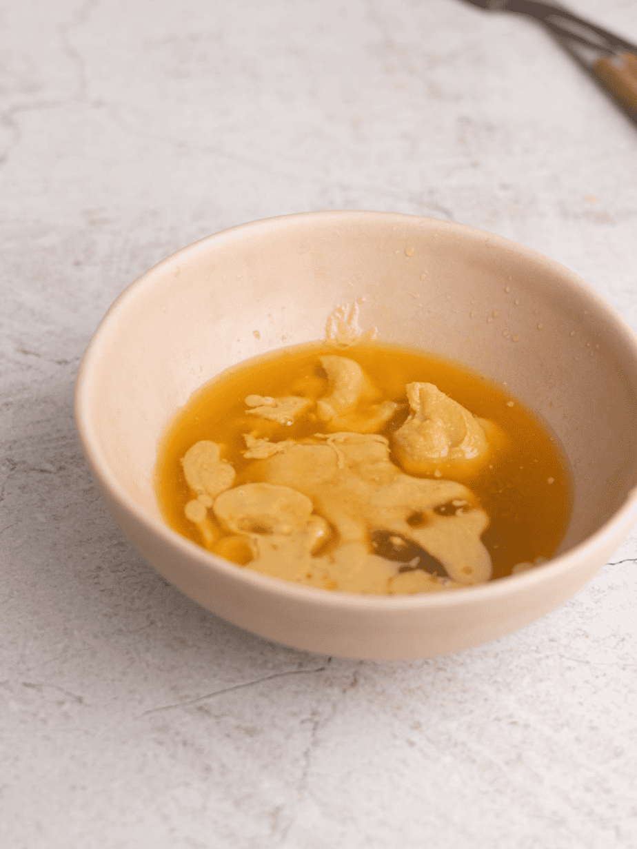 miso tahini dressing ingredients in a bowl before mixing